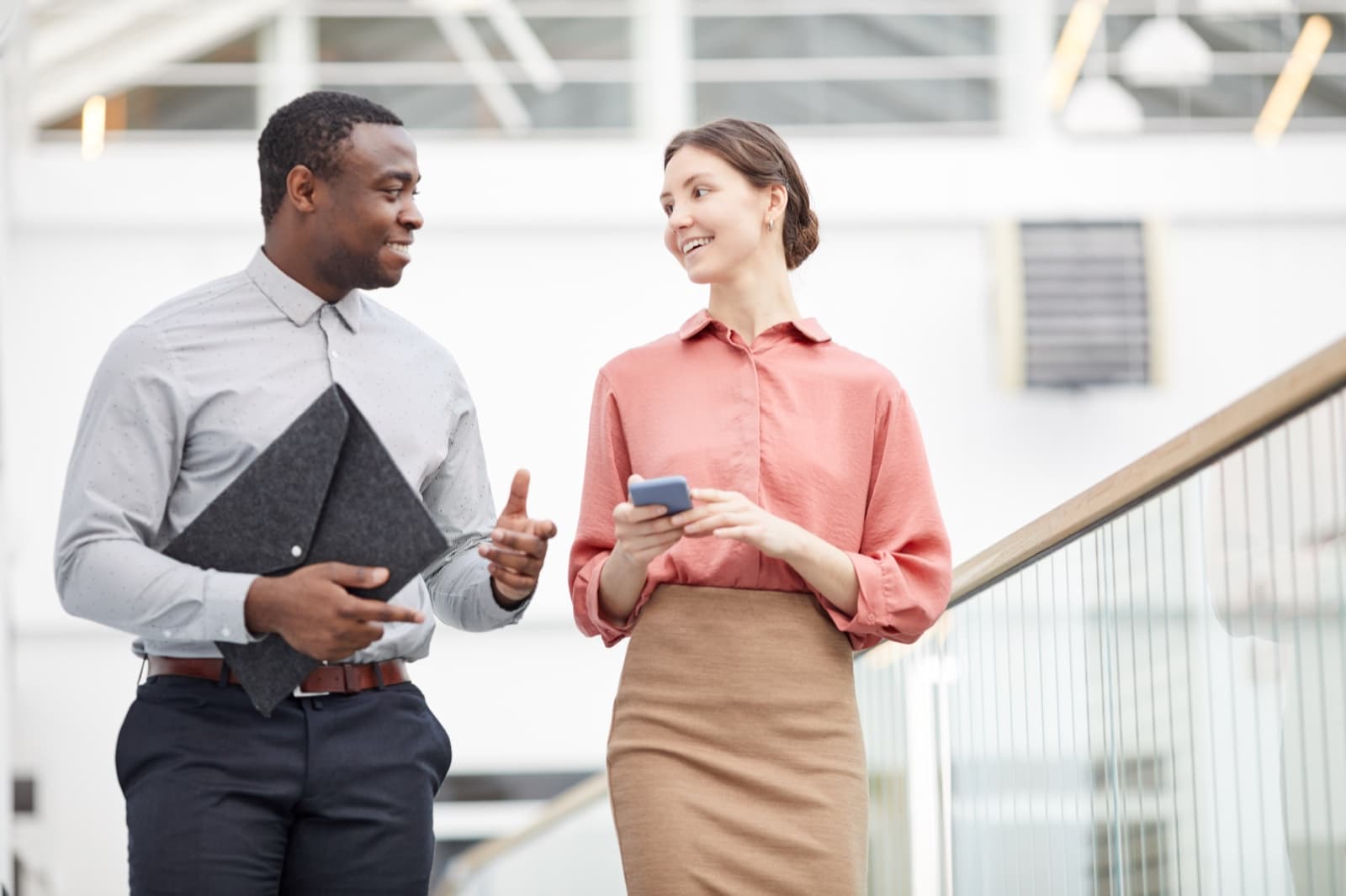 Project manager and colleague discussing a programme of work