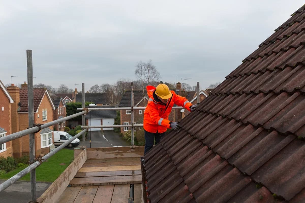 Roofer carrying out construction work on a domestic property under CDM 2015