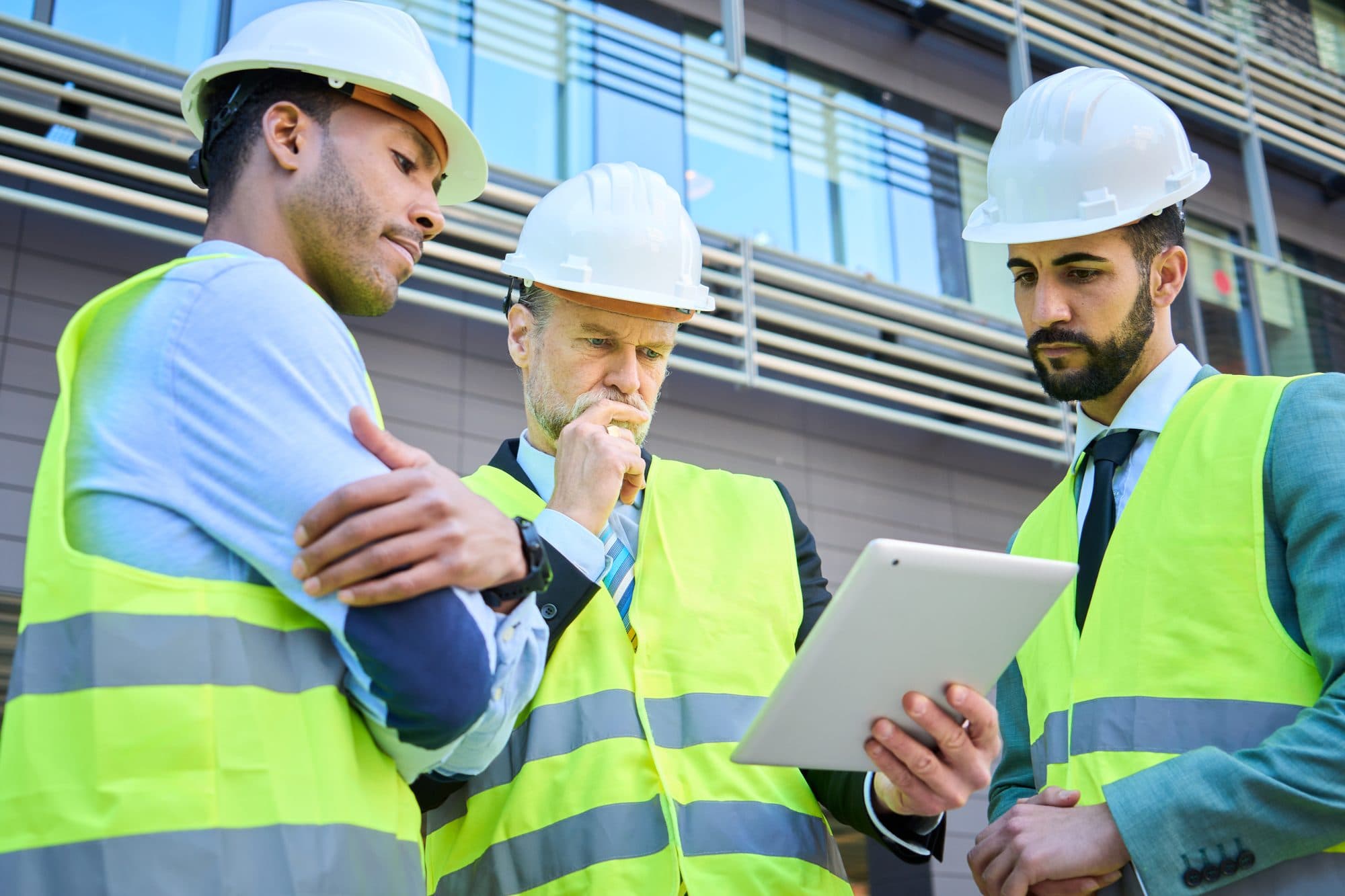 Construction project team reviewing information on site under CDM 2015