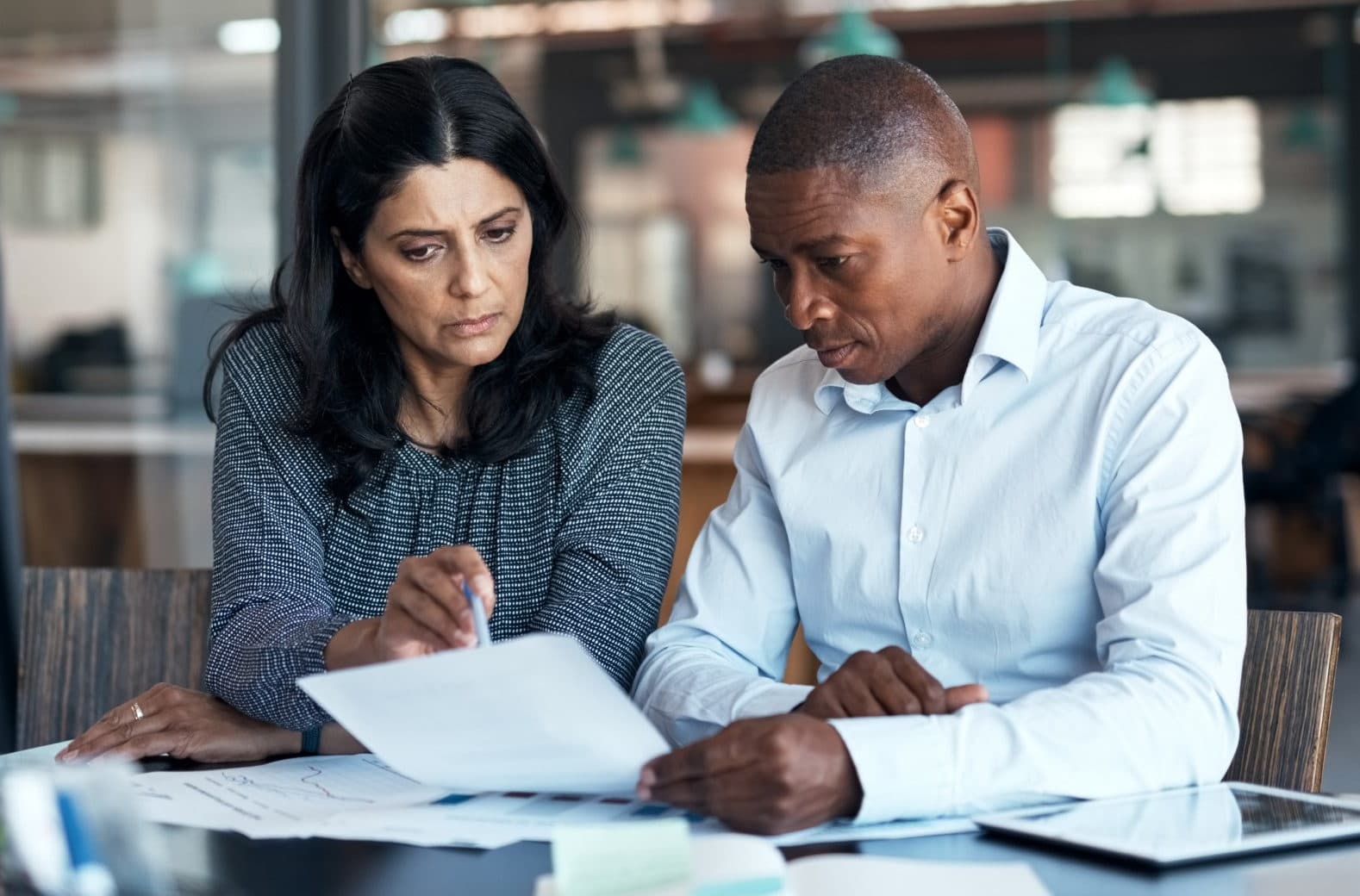 Project professionals reviewing documents as part of a CDM capability assessment