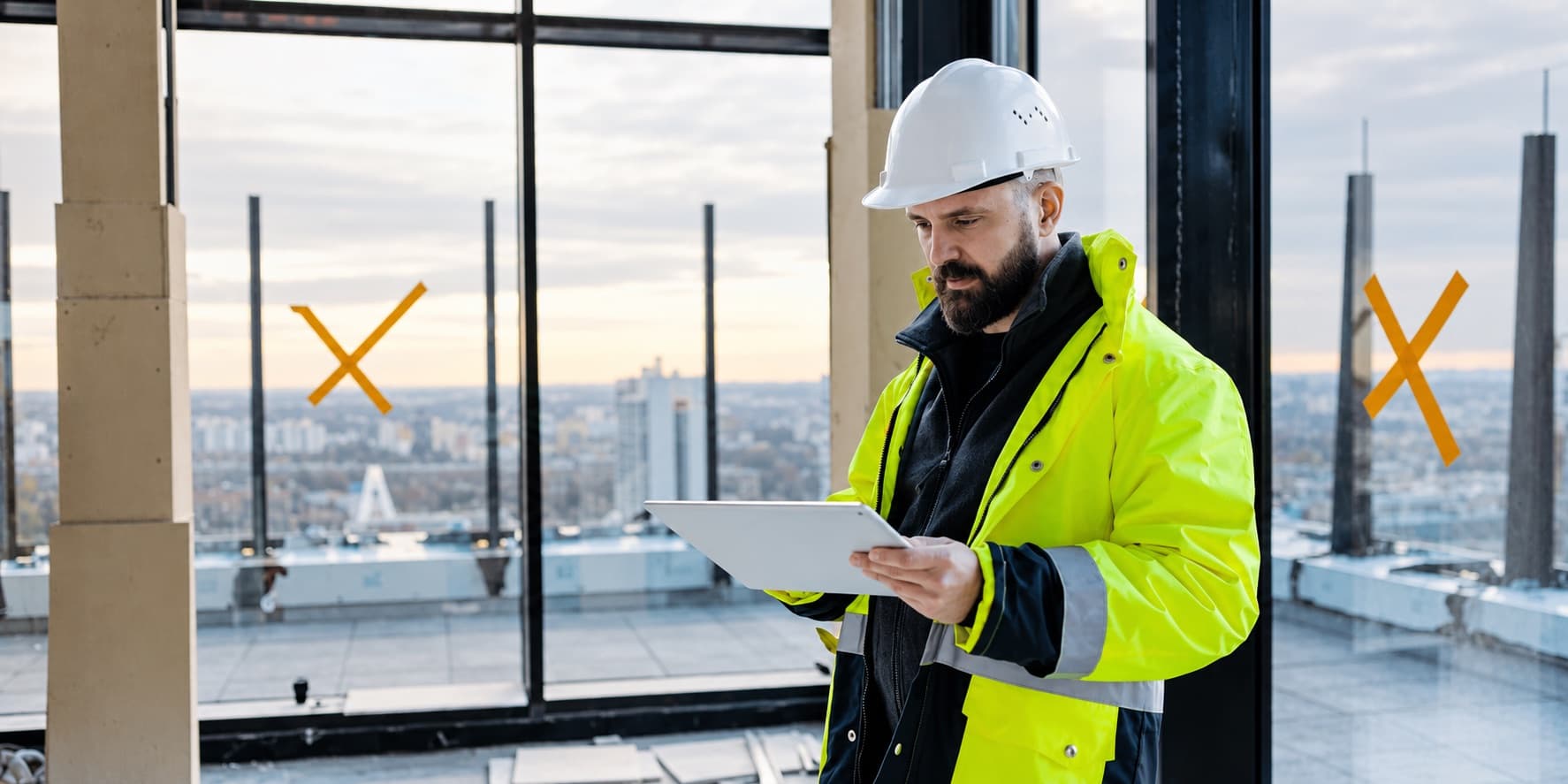 Construction professional reviewing building information for future maintenance and construction work