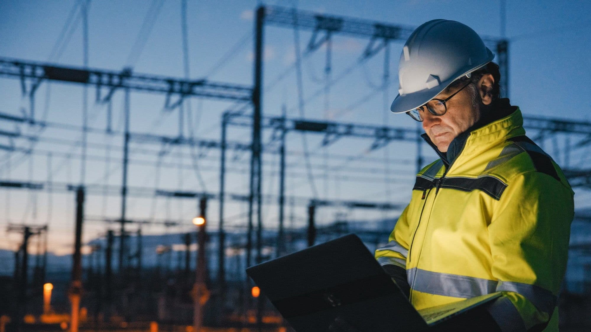 Construction professional reviewing risk assessment information on site