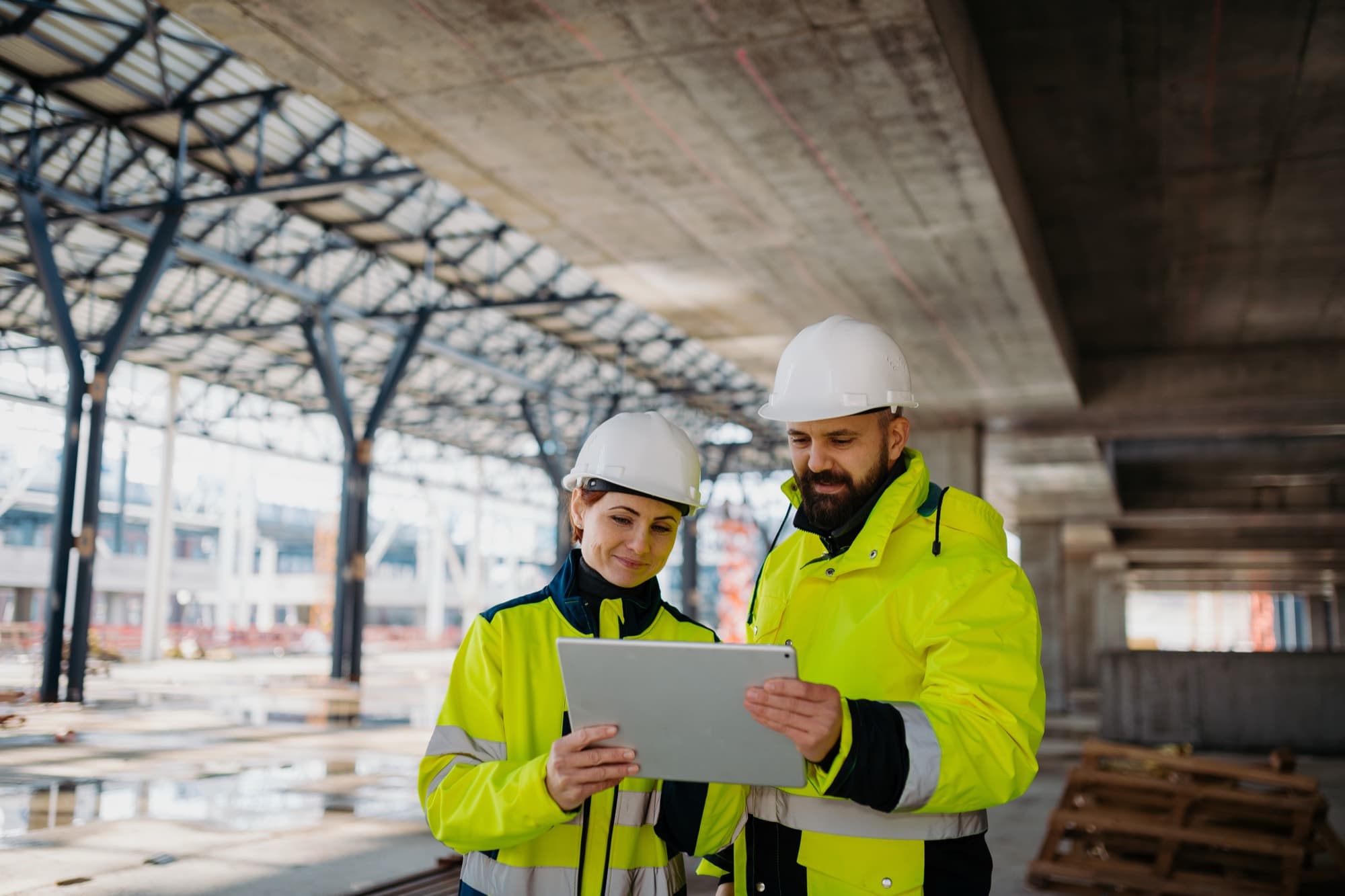 Construction professionals reviewing project information before construction work begins