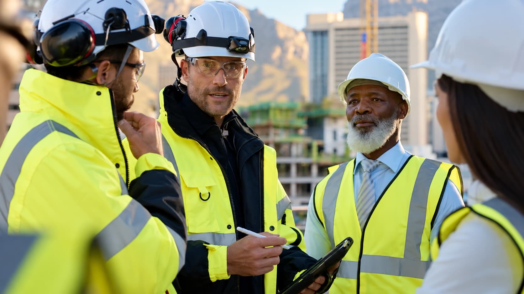 Construction management team coordinating work on site during the construction phase